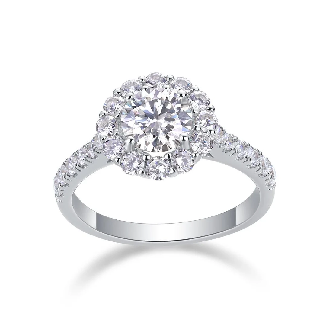 Round halo ring with a stone-set band on a white background